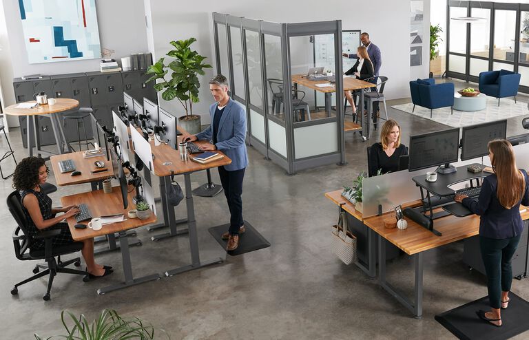 Individual working in office with vari products