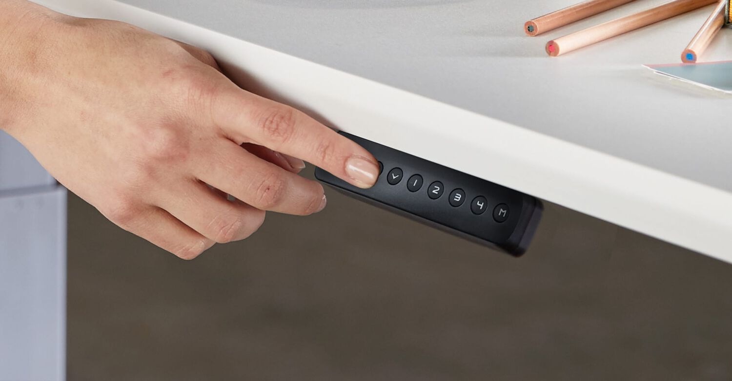 memory presets being used on a control panel of a vari electric standing desk