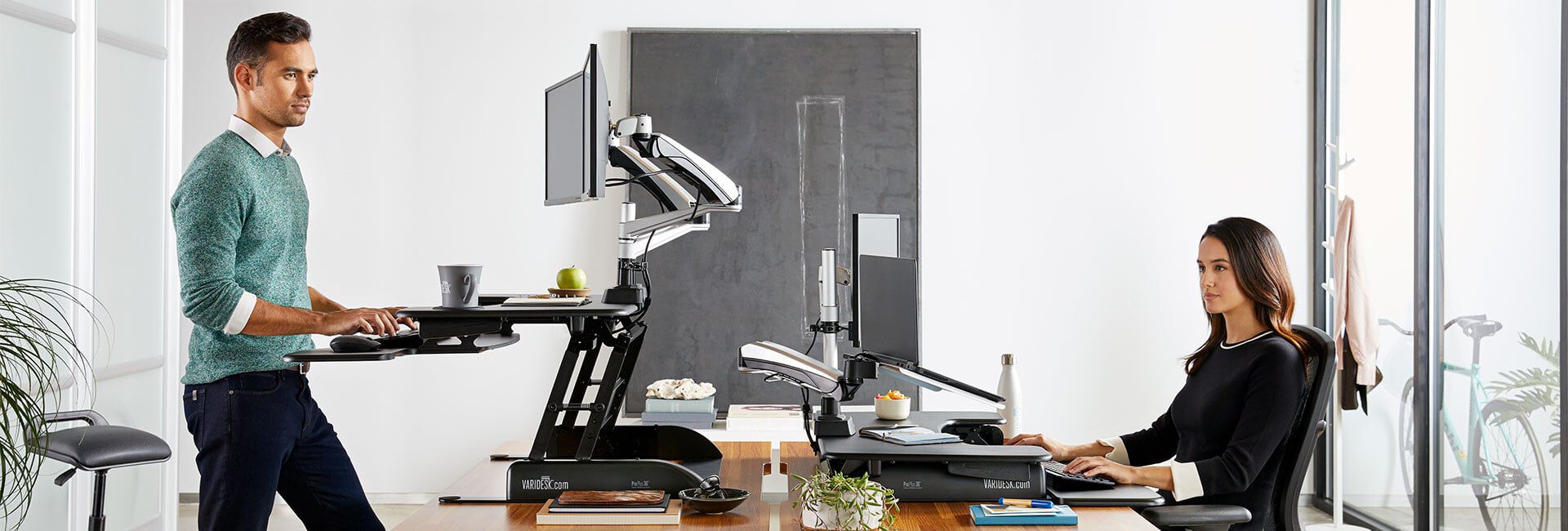 two professionals working in an office with vari products