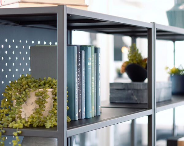 close up view of the the top shelf of the five tier open shelf with the five tier shelf back panel installed
