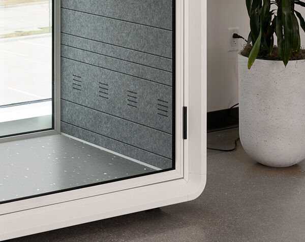interior of privacy booth with a focus on thew all
