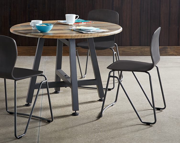 seats shown around round table in breakroom