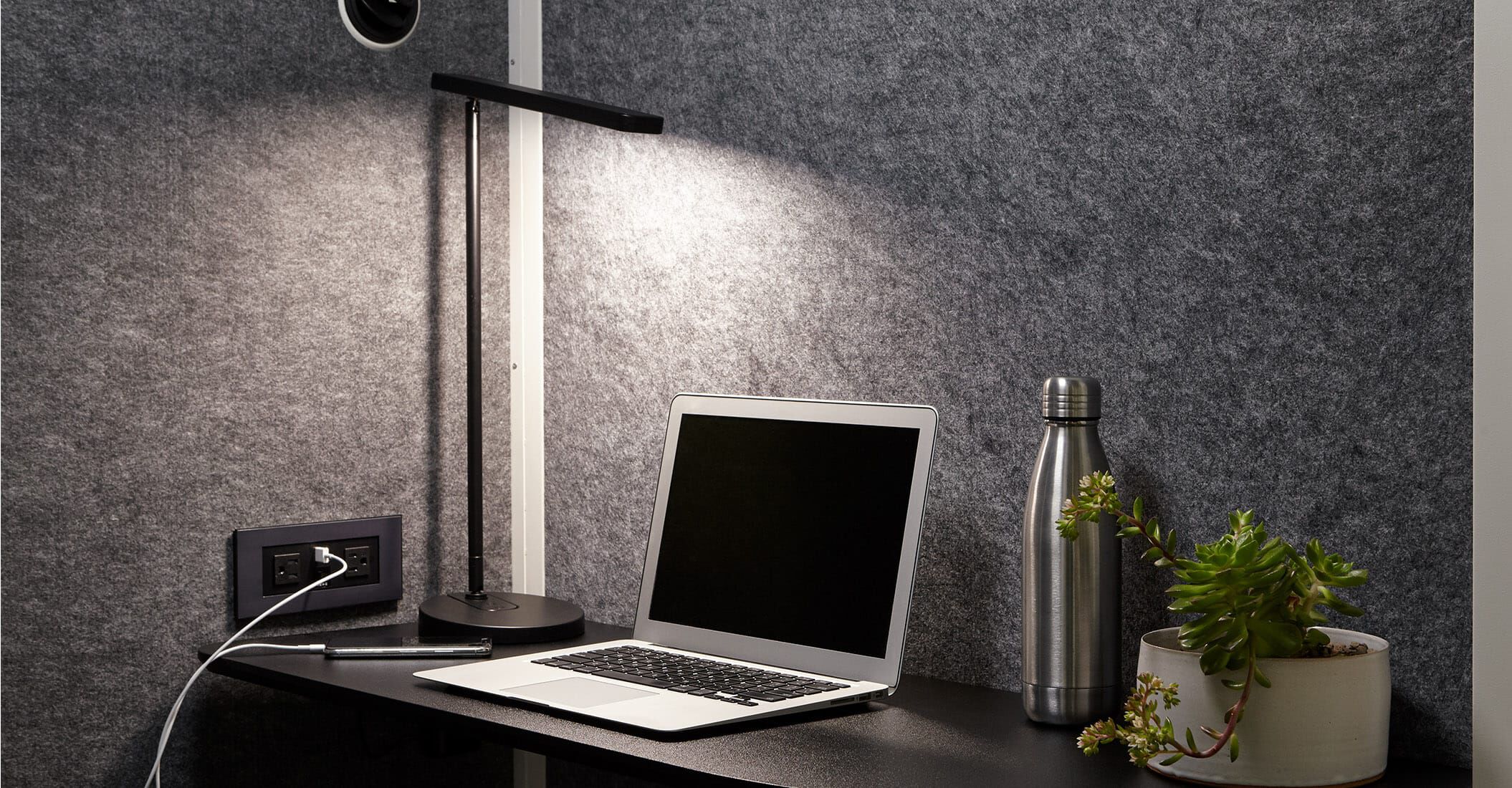 inside the vari privacy booth, power outlet and vari task lamp are shown