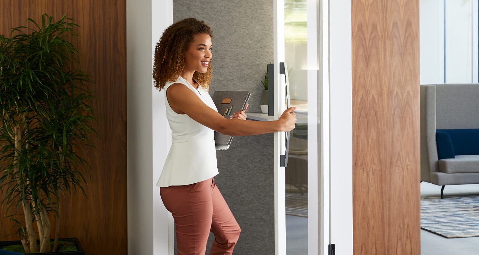 professional entering privacy booth