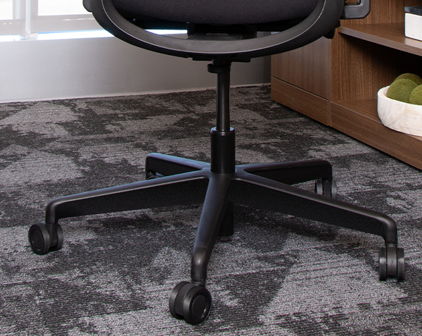 Vari TempurPedic chair wheels displayed on a rug