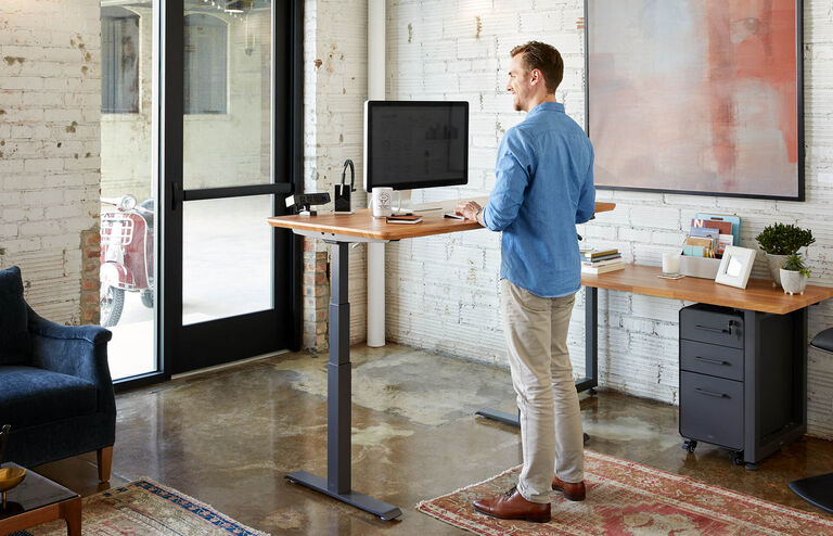 individual working in office with vari products