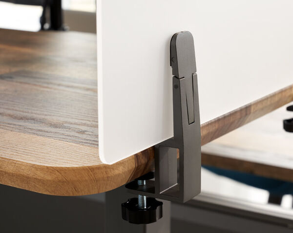 Acrylic in panel separates desks while still letting in light