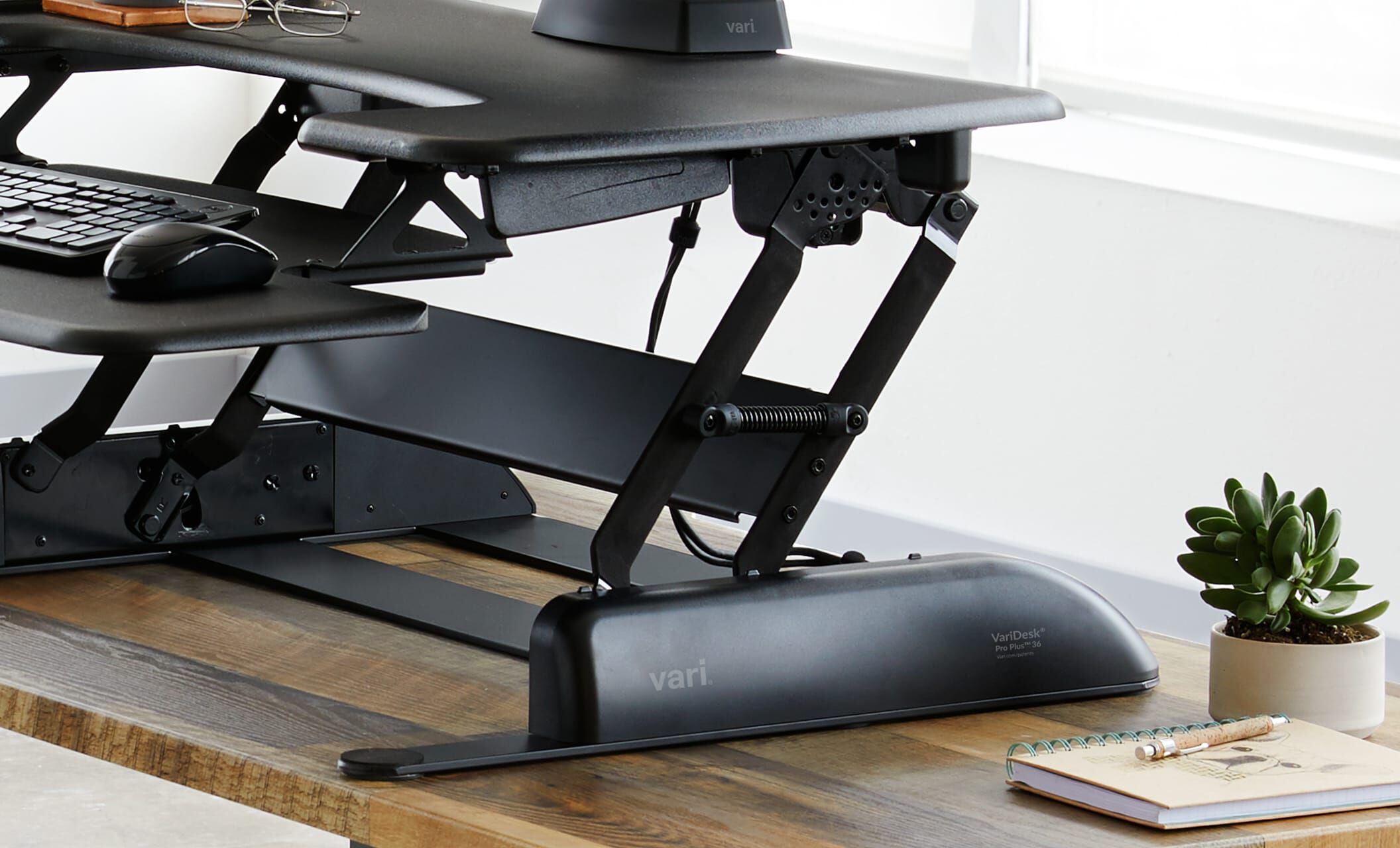 Converter is raised in an office setting to show the spring-assisted lift