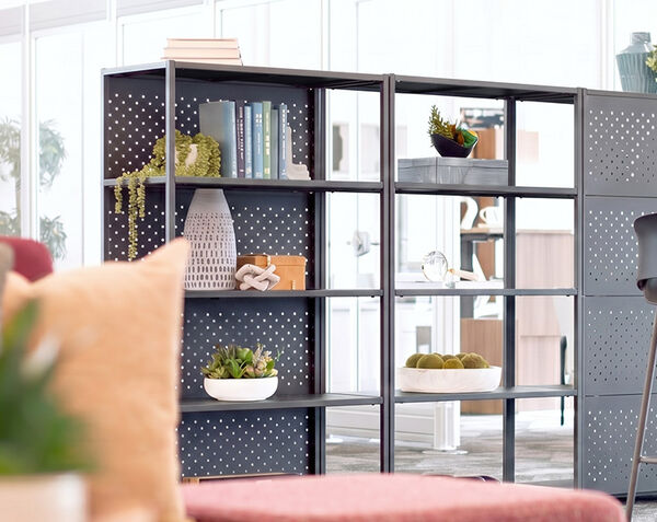 five tier shelf back panel installed on a five tier open shelf in an open office setting