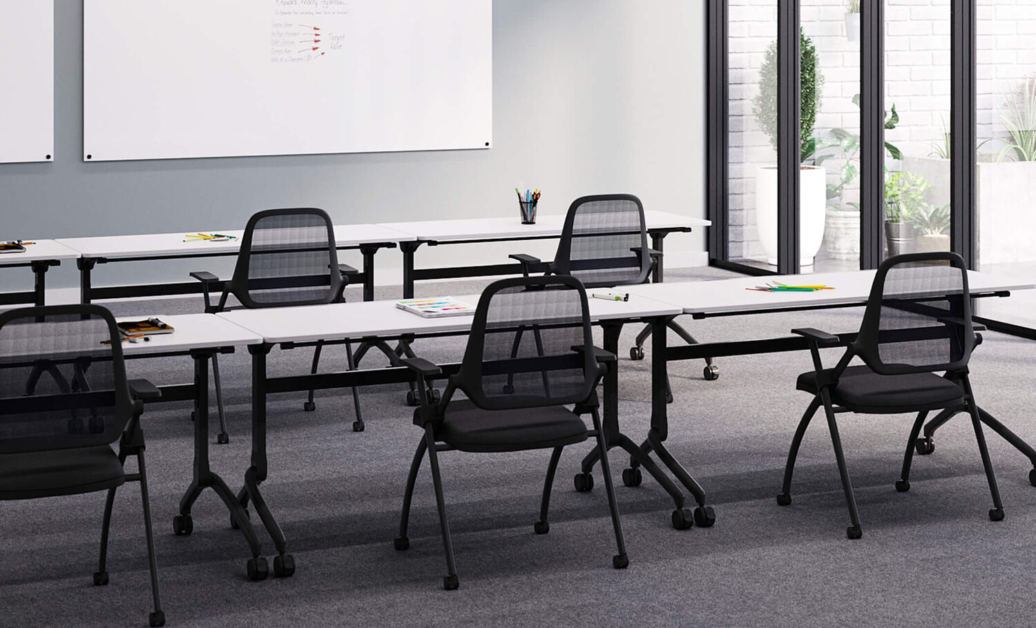 vari flip top training table and nesting chair arranged in training space