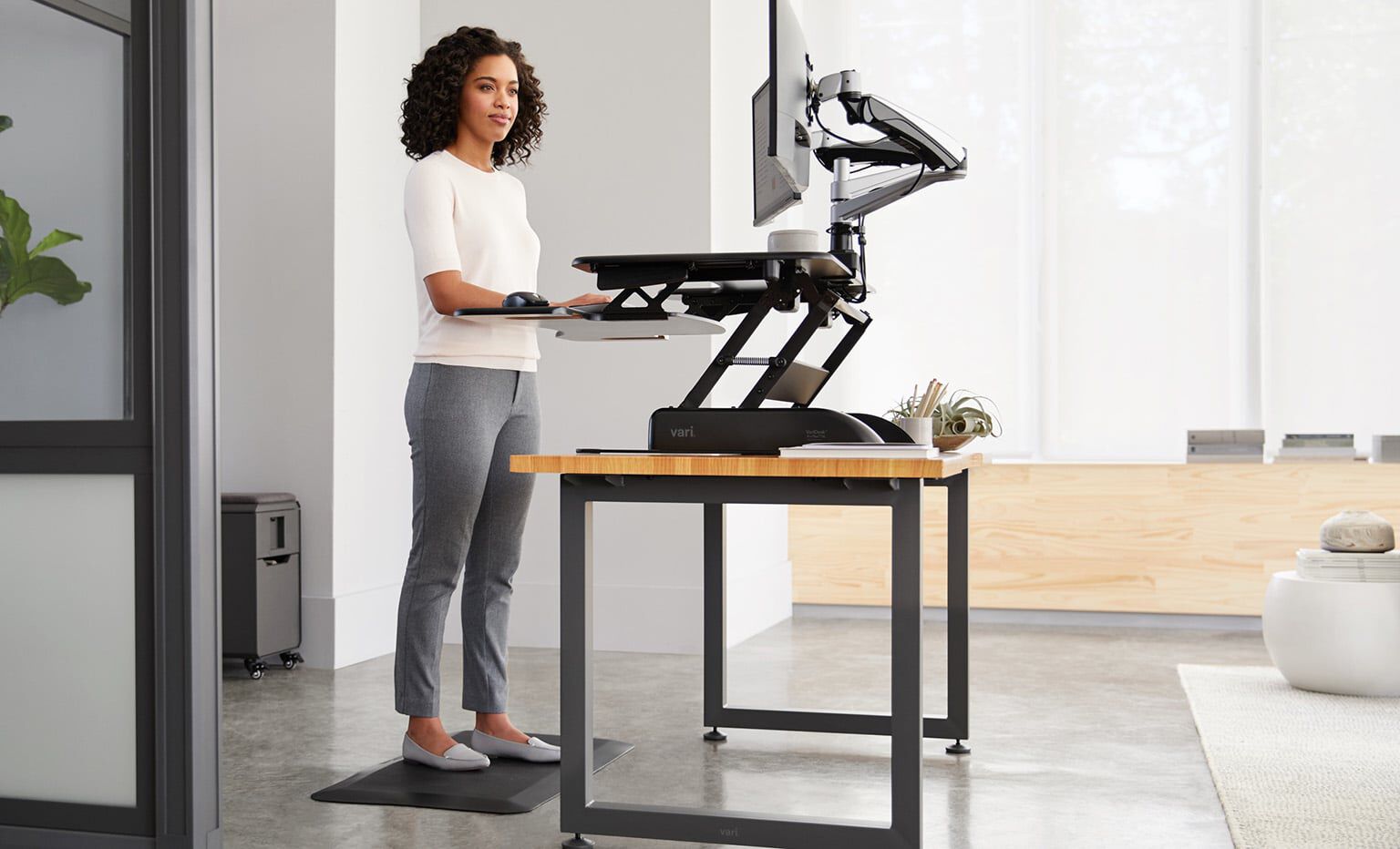 varidesk standing desk converter in use