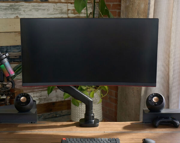 professional adjusts monitor to see screen comfortably