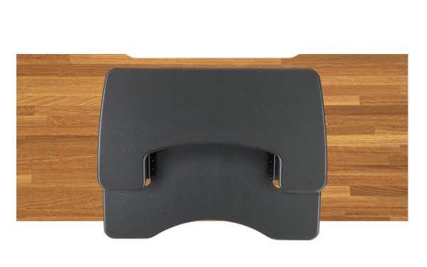 sit-stand desktop converter on top of a fixed height desk to show relative size, placement, and fit