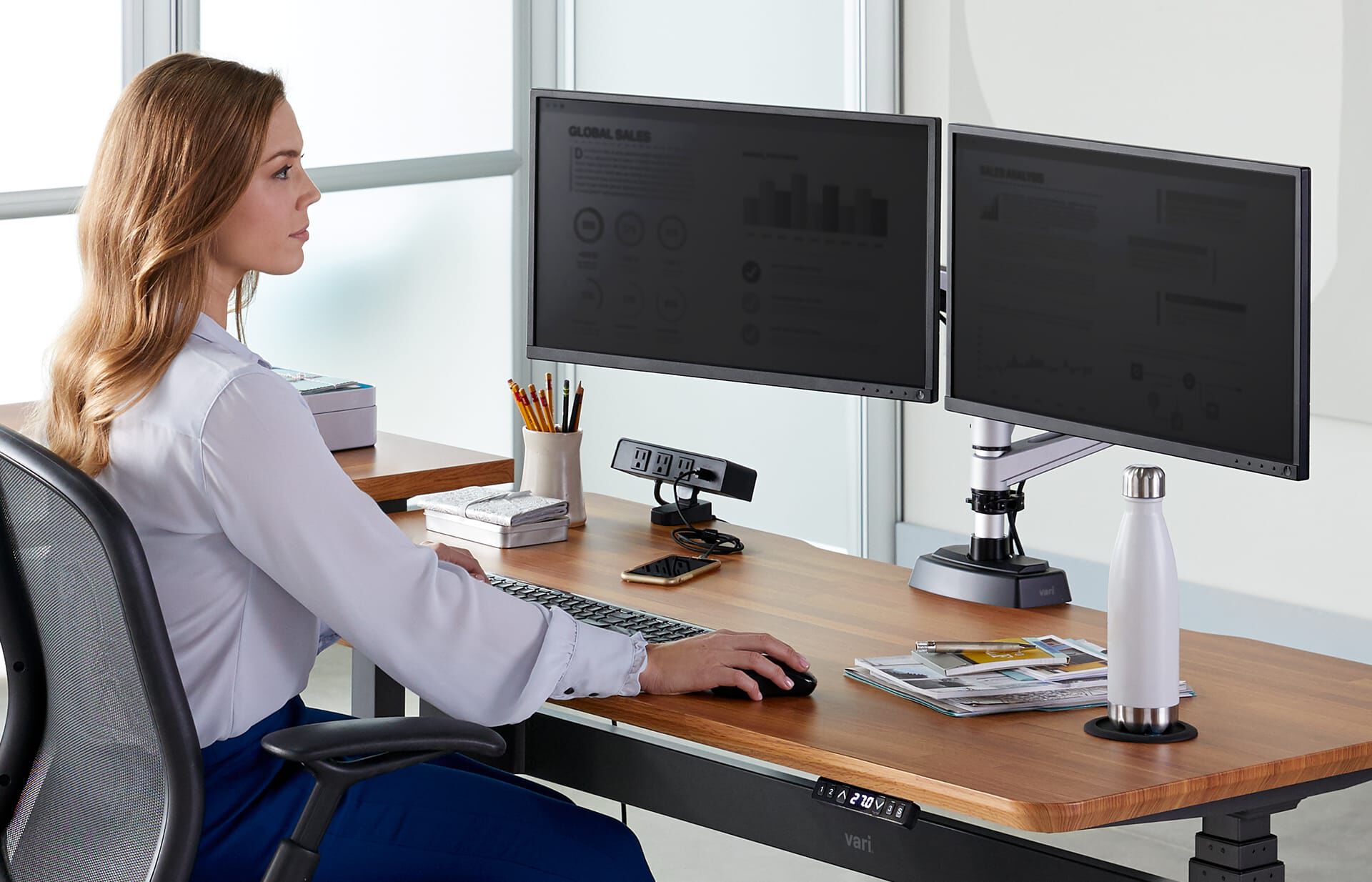 individual working on desk with vari power hub
