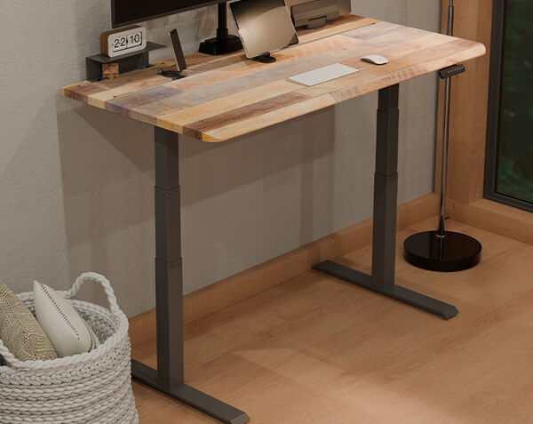 view of underneath the desk showing space between a cabinet and desk utilizing the drop-stop safety sensor