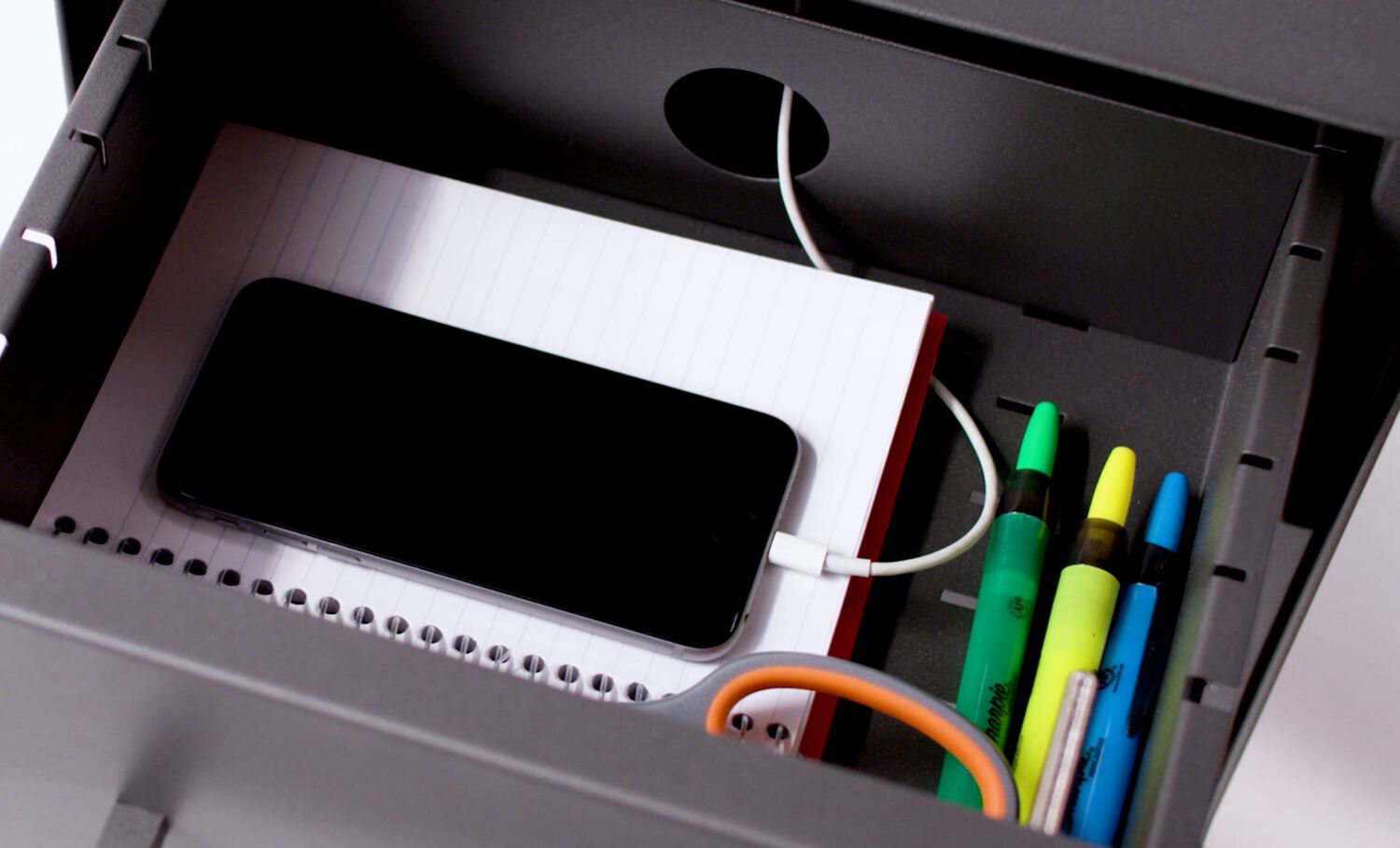 Cell phone charging in Vari file cabinet drawer.