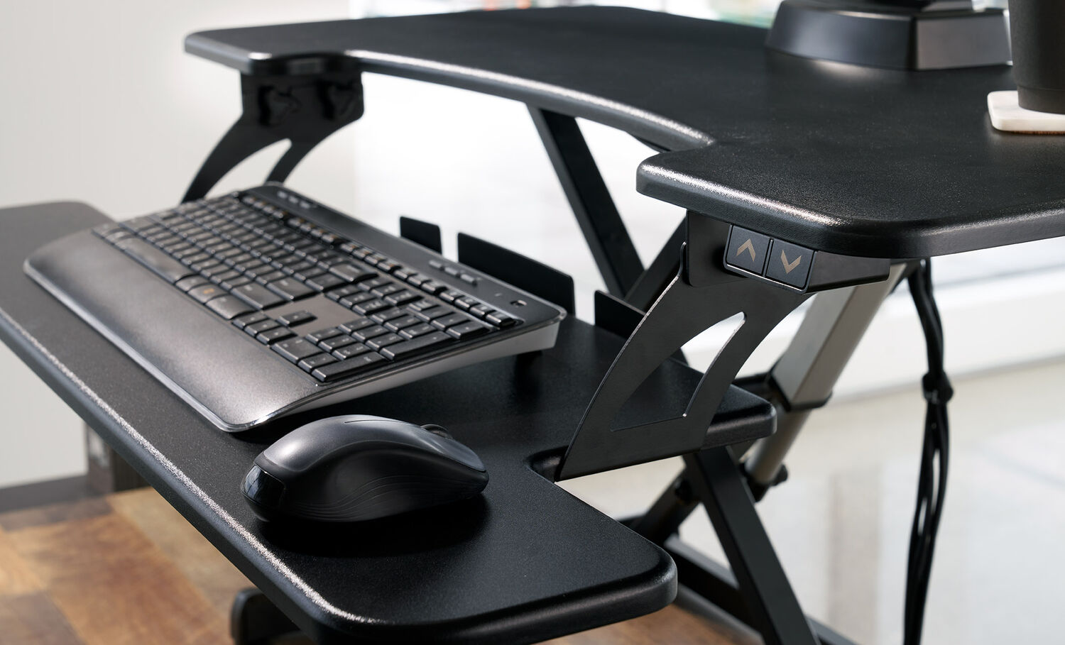 close up view of keyboard tray on an electric desk converter