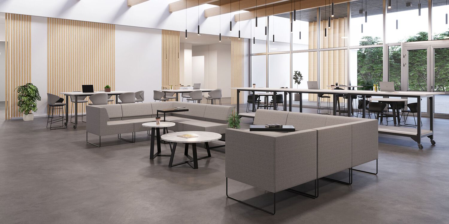 a few desk pushed together to create a desk pod