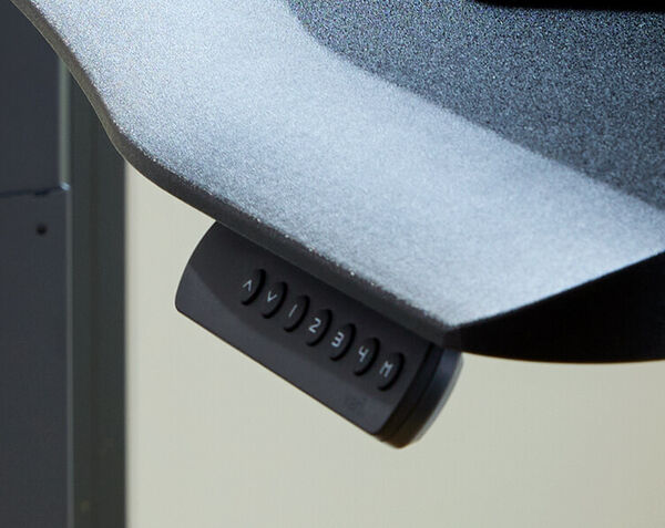 Control panel shows buttons for four programmable height settings