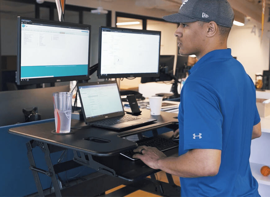 topgolf professional working at a varidesk cube plus 40  image