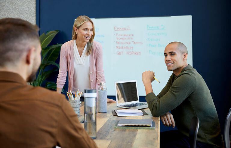 Individuals meeting on vari conference table