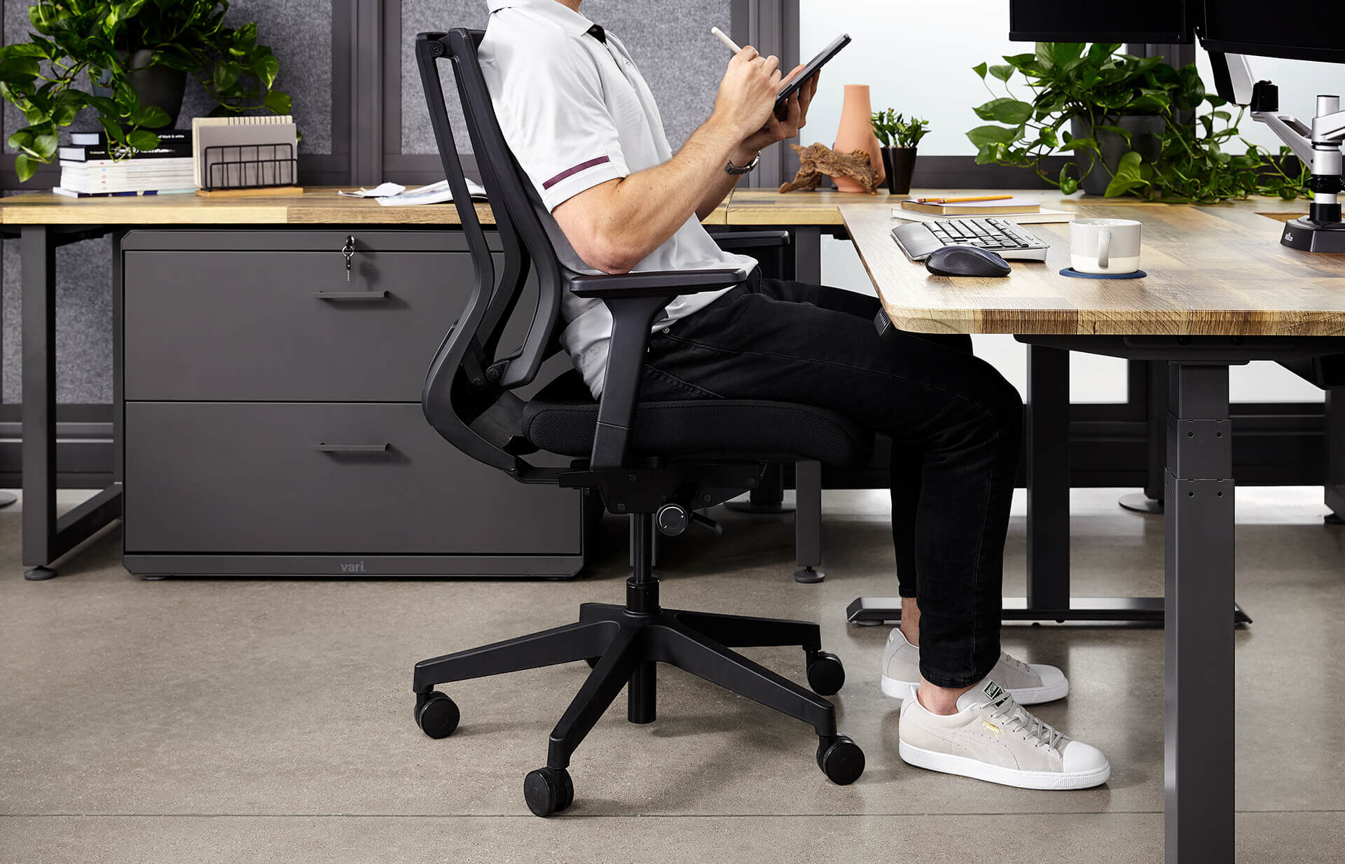 individual working in office with vari products