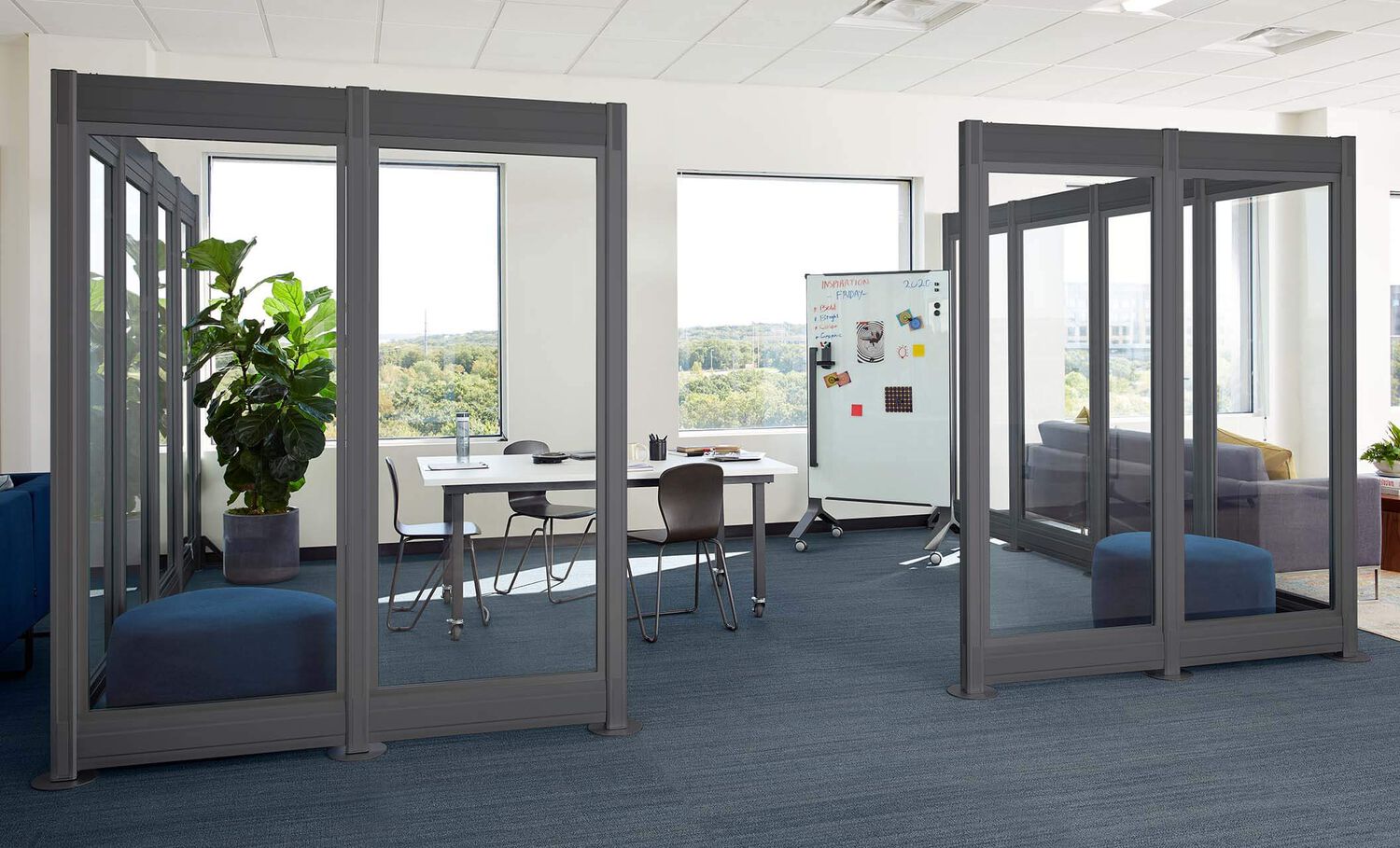 2 professionals meeting in conference room built with quickflex walls