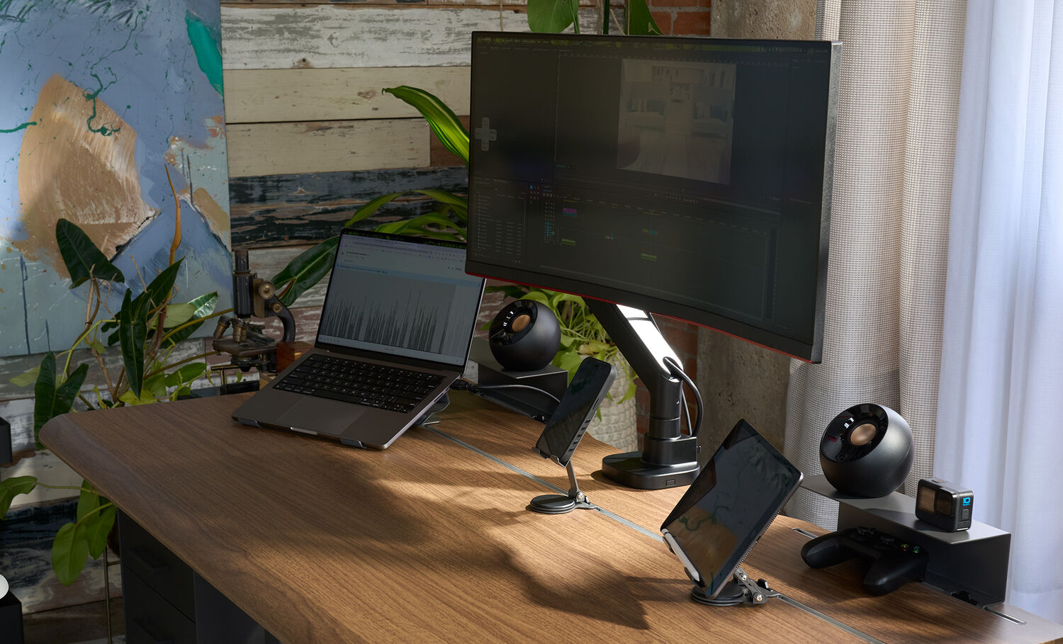 close up of desk in office environment using ultra wide monitor arm