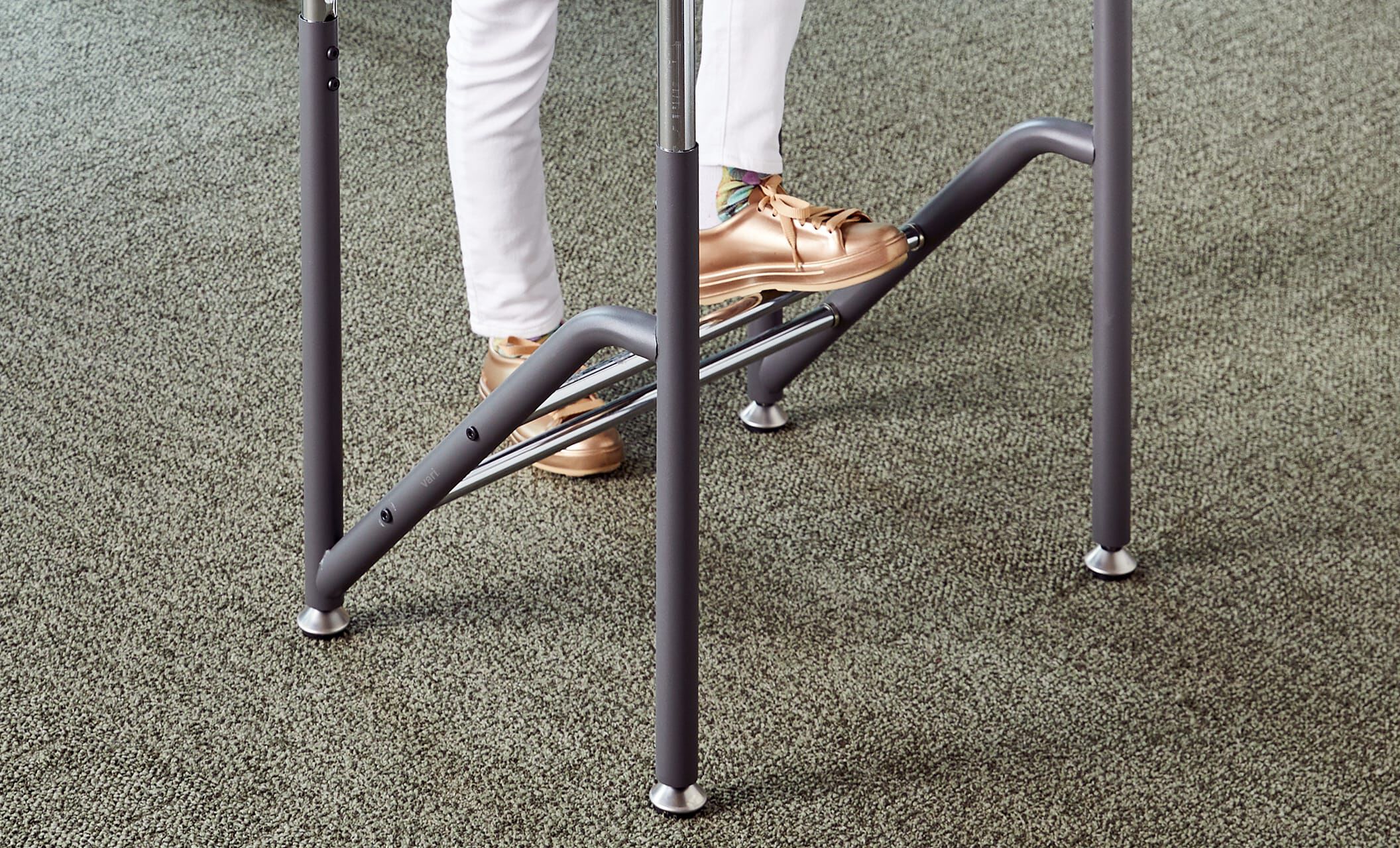 Individual using dual foot rest