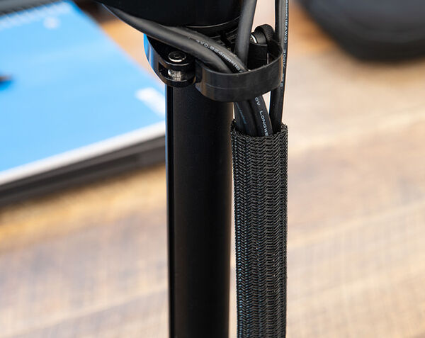 black cable sleeve wrapped around a trio of cables