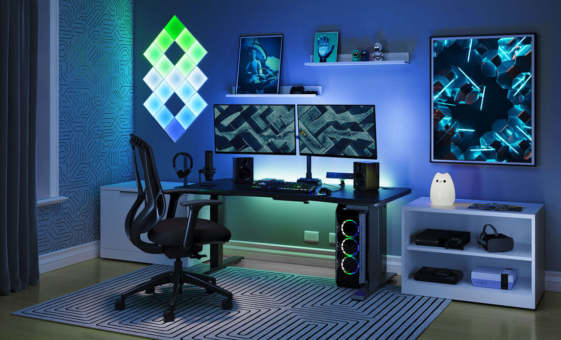 Closeup view of Curve Electric Standing Desk 60x30 desktop with mounted monitors