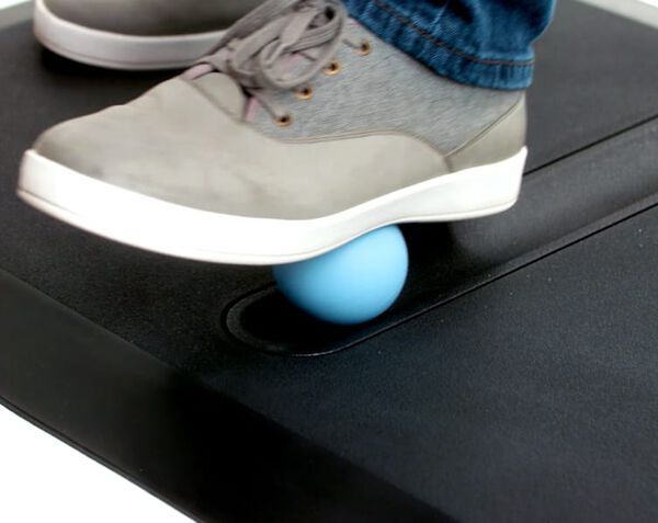 individual standing on vari active mat