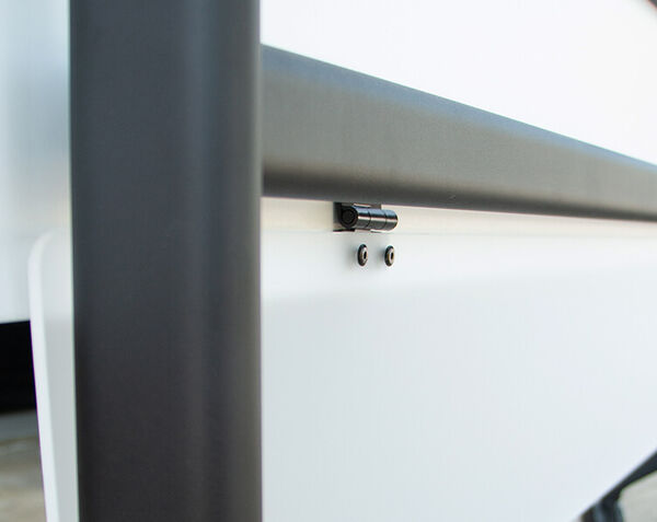 closeup of flip top training table modesty panel hinge