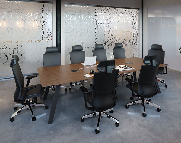 close up of chairs setup around the executive conference table in a conference room