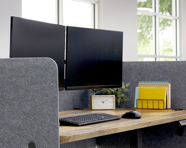 Vari felt panel attached to electric standing desk