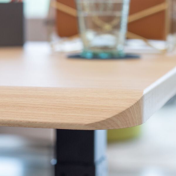 Individual standing at desk in office setting
