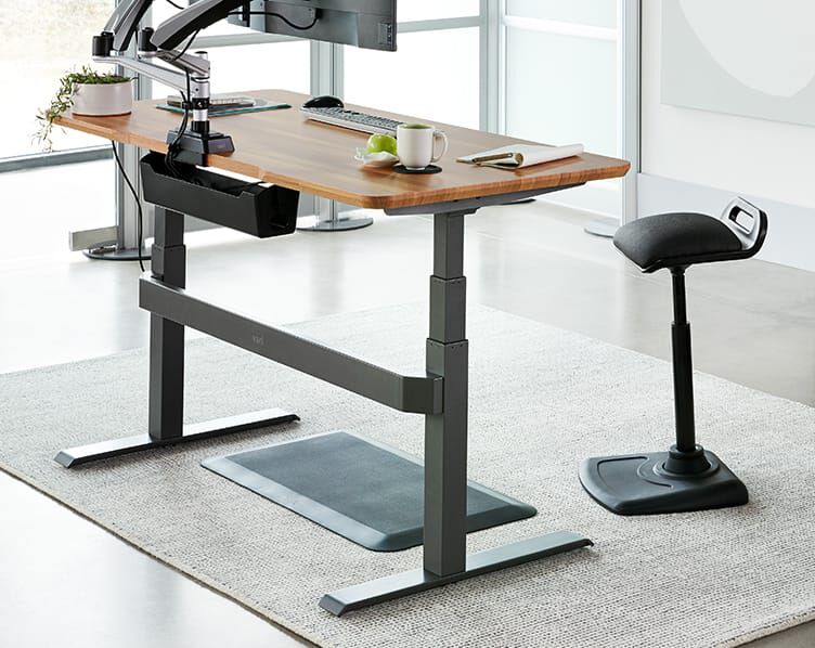 mat seen fitting perfectly between legs of Electric Standing Desk 48x30