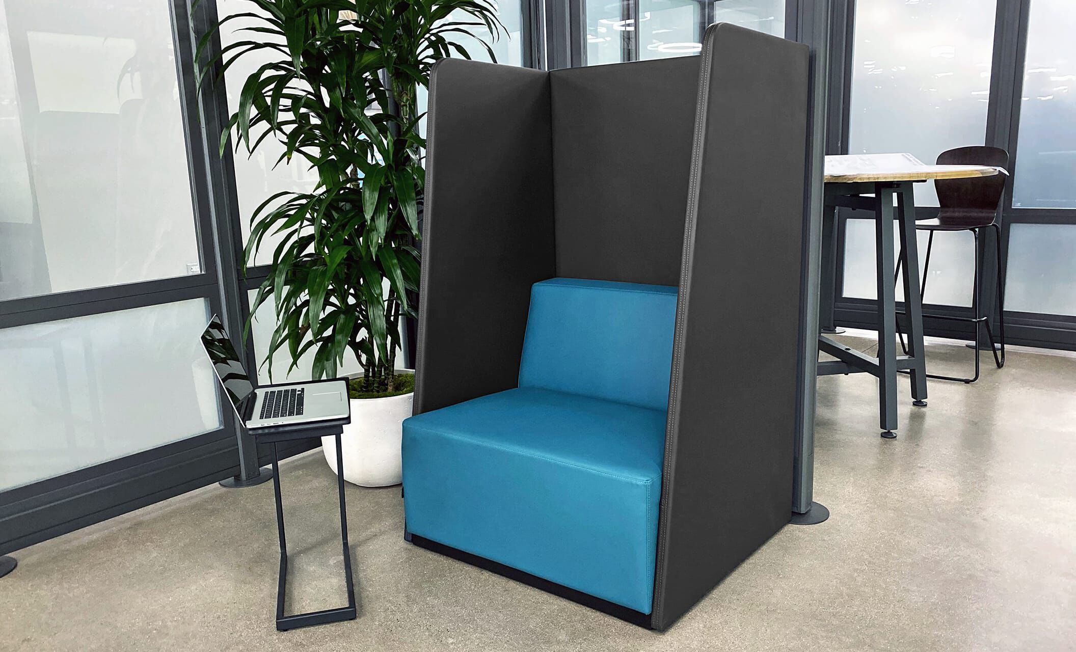 Faux leather high back chair and laptop side table in private working area