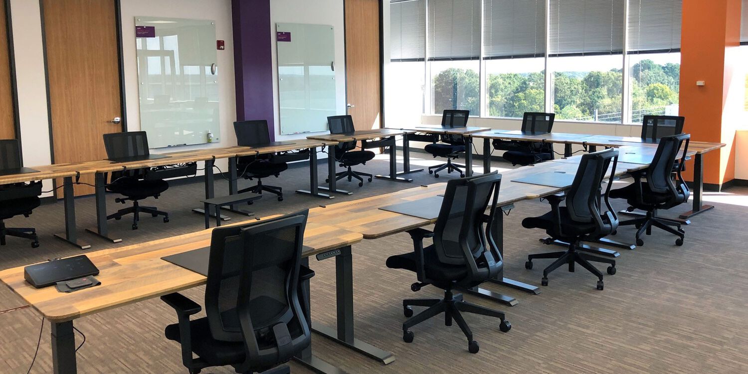 meeting room with tables and chairs facing each other