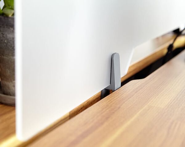 close up image of the frosted acrylic privacy panel attached to a table