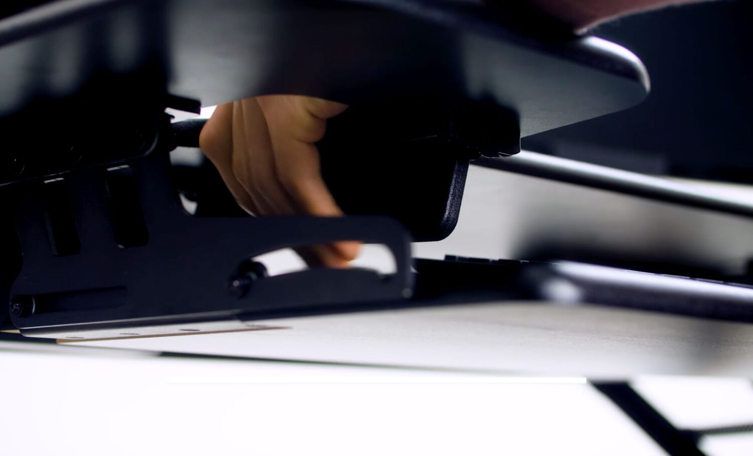 Bottom view of VariDesk Tall 40 handles in use