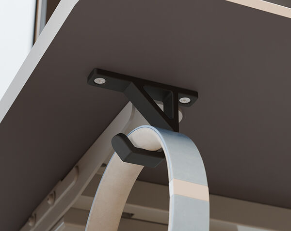 vari desk hook clamped on to a desk or table holding a bag
