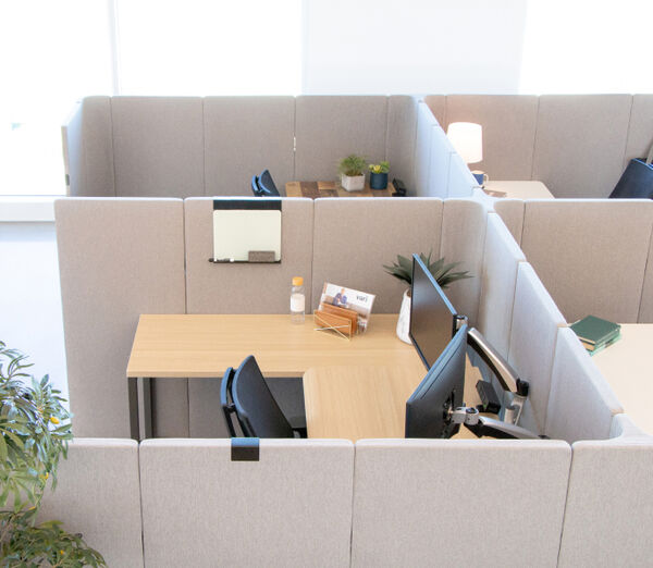 overhead view of a group of cubicle workspaces in an office setting
