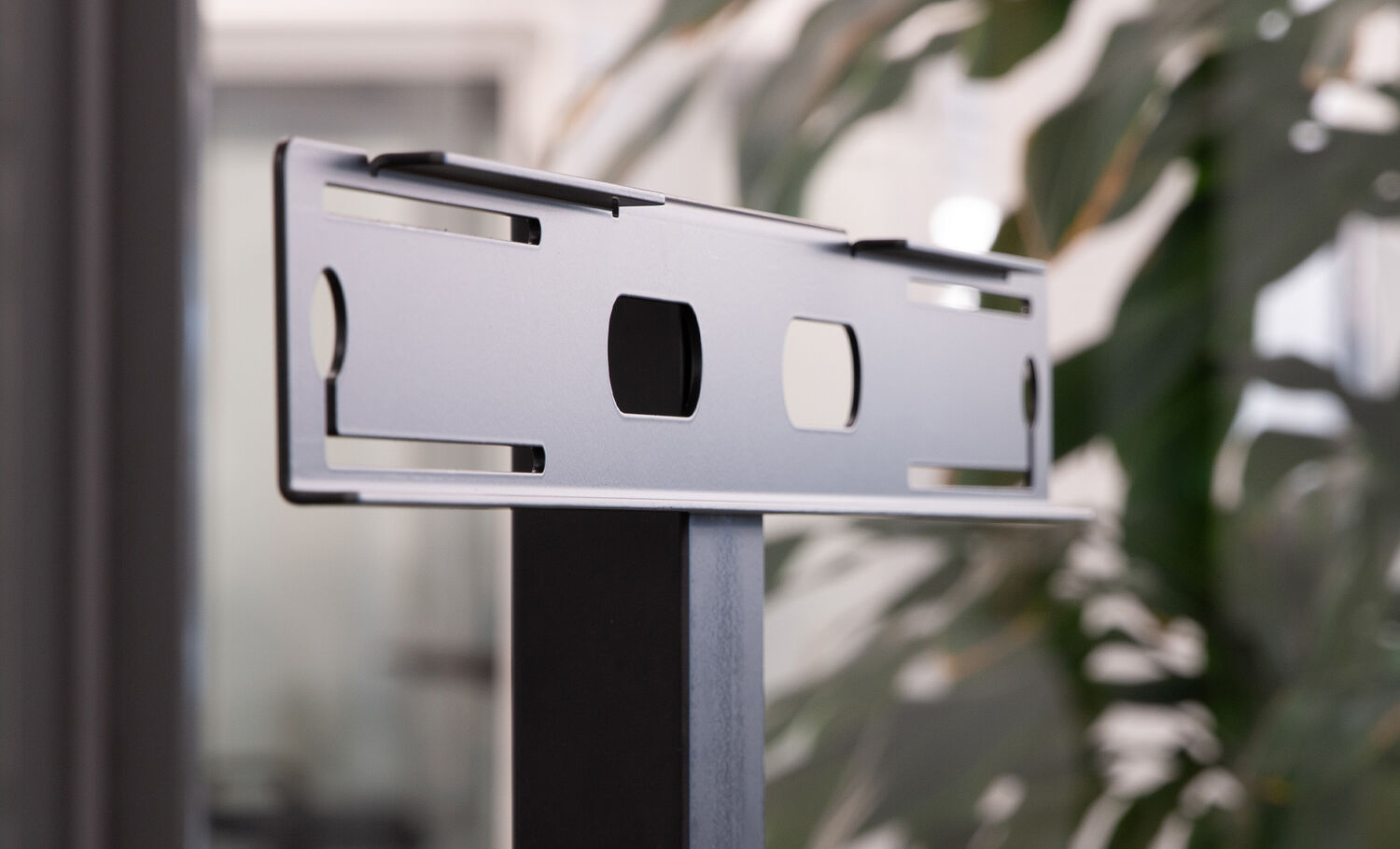 Close up view of the premier electric monitor mount that converts the electric single monitor to a dual monitor