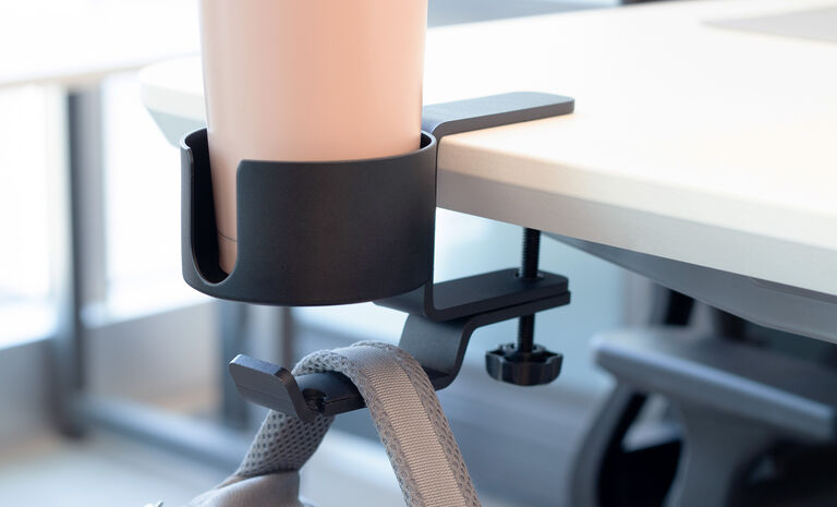 full workstation of vari products with the glass chair mat in use on top of a rug
