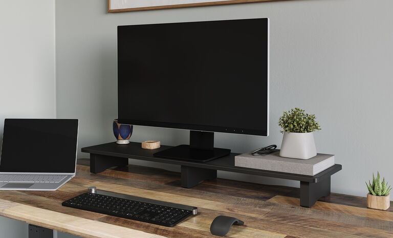 Desk Shelf assembled and setup with a monitor on an electric standing desk