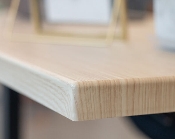 close up of light wood finish table in 48 x 24