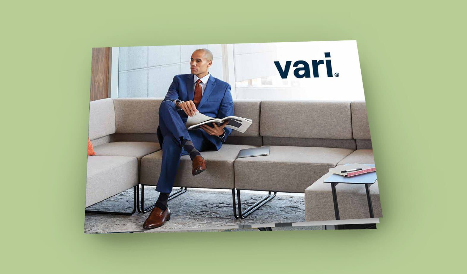 cover of lookbook showing a professional sitting on sectional