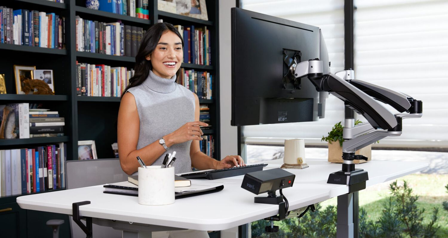 Workspace with a standing desk and a variety of desk accessories