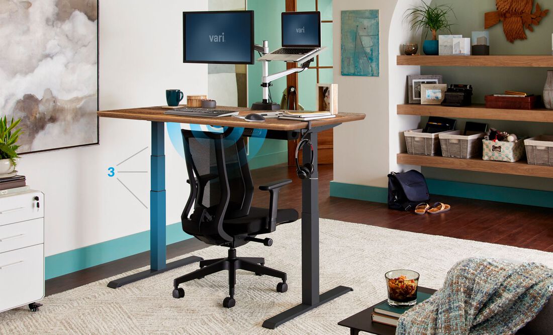 Home office setting with an electric standing desk.